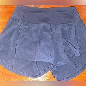 Lululemon running shorts with zipper pocket, built in underwear. Size 0. Navy.